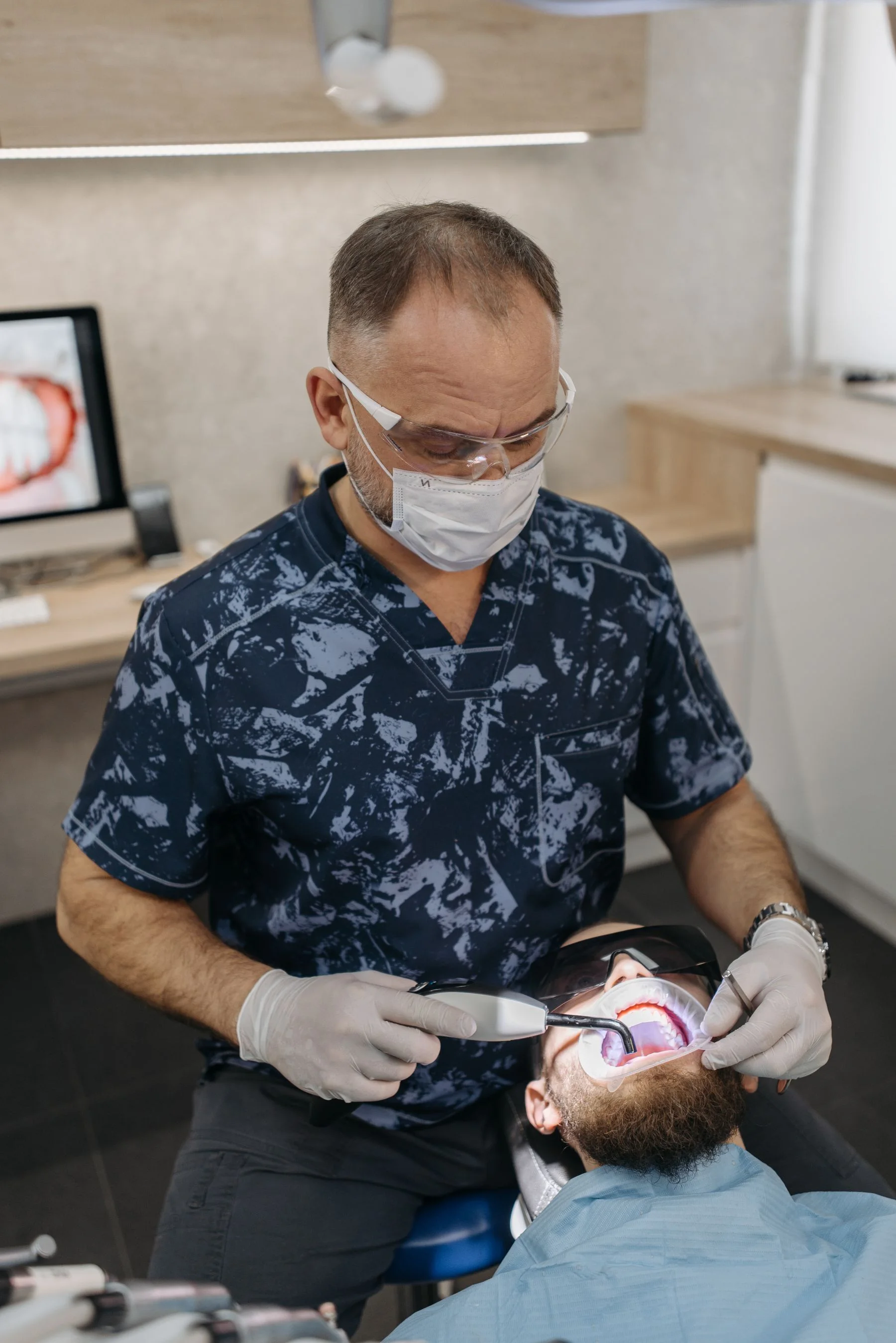 Dentist evaluating a patient with an urgent concern