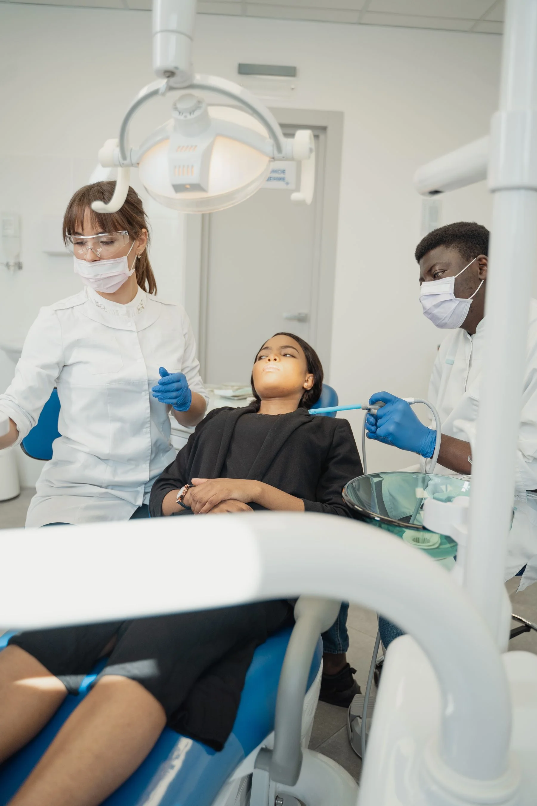 Dental team collaborating around patient care